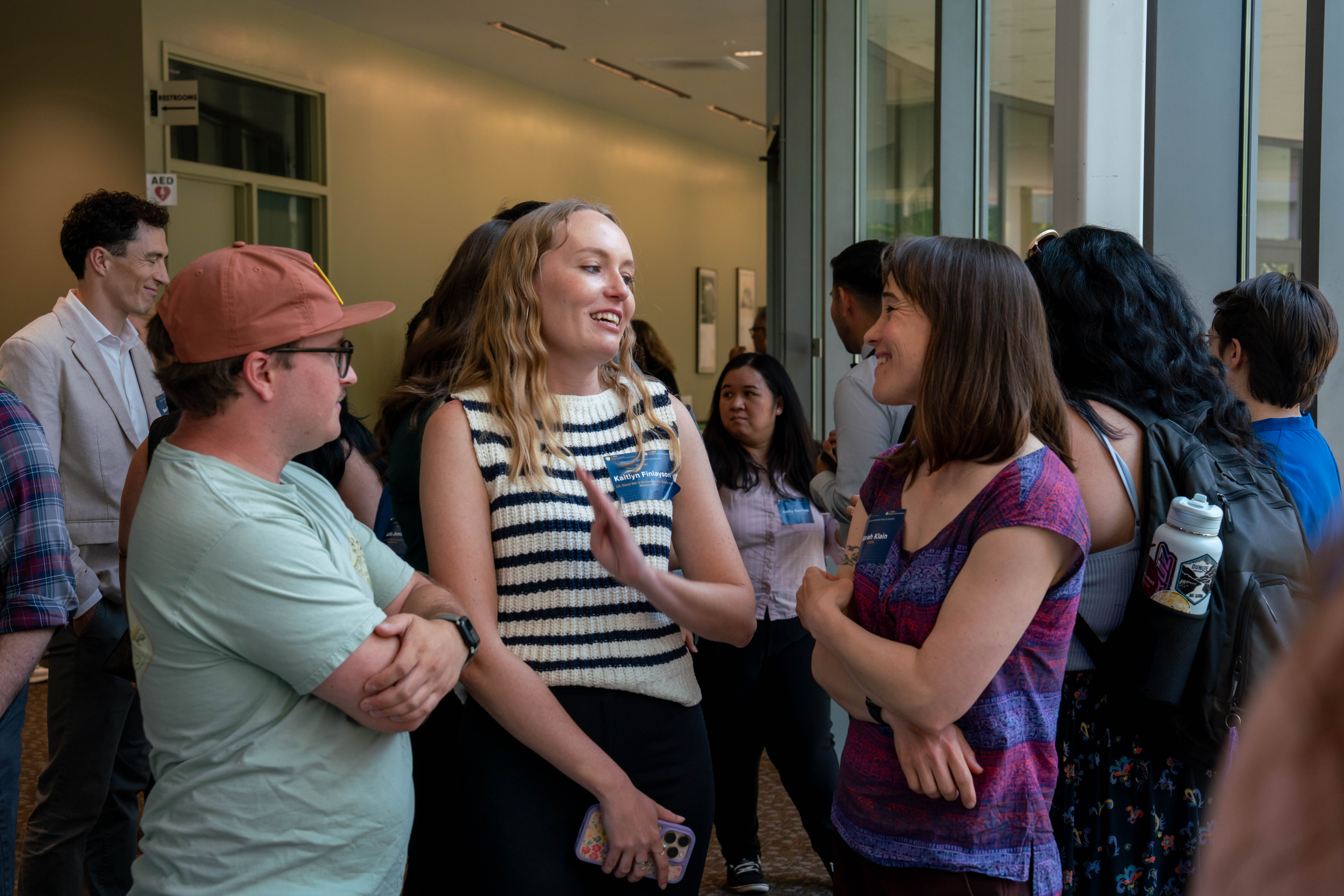 EPM student Kaitlyn Finlayson chatting with her client, Dr. Sarah Klain from Oregon Department of Fish and Wildlife at the Symposium reception.