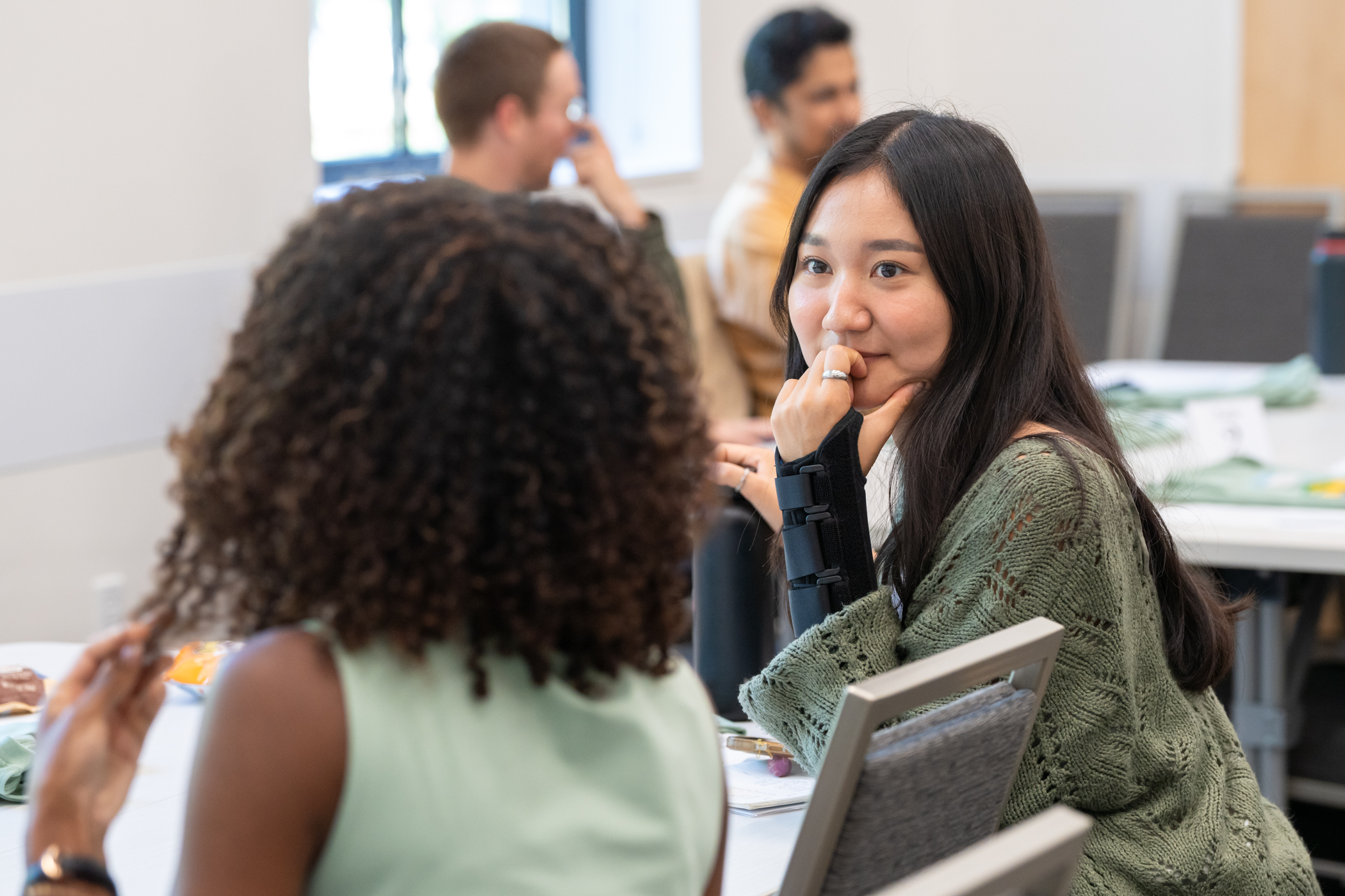 EPM orientation photo of two students talking.