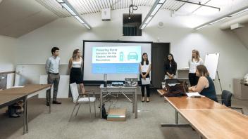 Students working with the Center for American Progress present their project at UCD