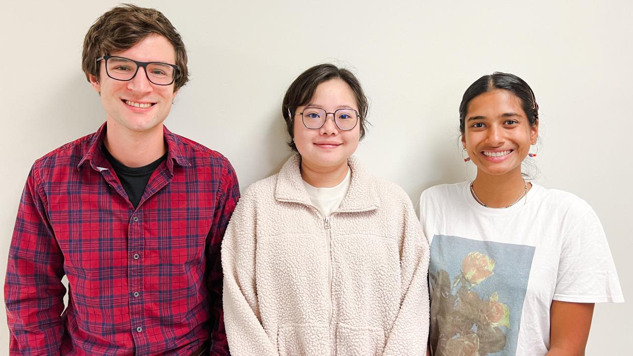Liam Huber, JieQi Yan, and Tara Khan featured in front of a white wall.