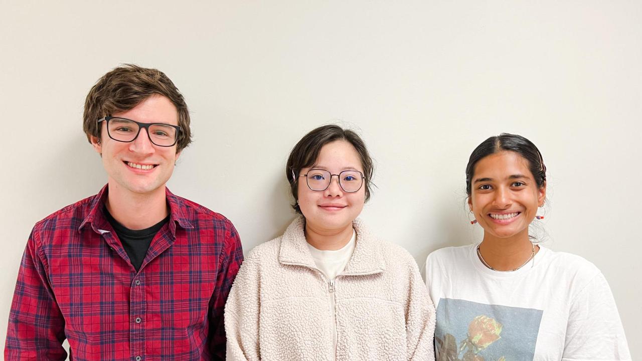 Liam Huber, JieQi Yan, and Tara Khan featured in front of a white wall.