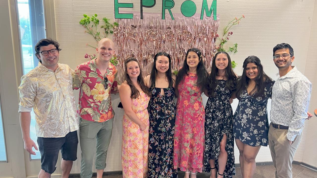 EPM's Social Committee poses in front of EProM decorations