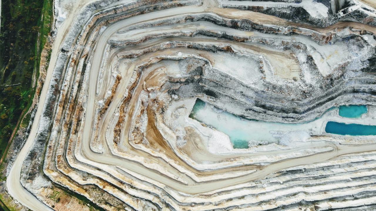 drone over a quarry photo by Dion Beetson on Unsplash