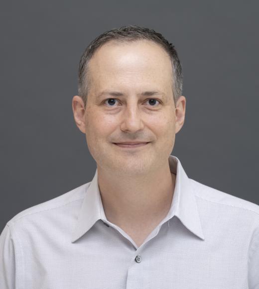 Federico Pacheco featured smiling against a grey background