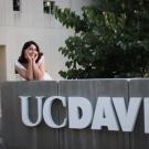 Sara featured in front of the "UC Davis sign"