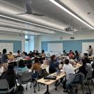 Students in a classroom discussion setting