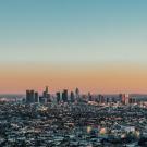 Los Angeles, CA cityscape with sunset in background